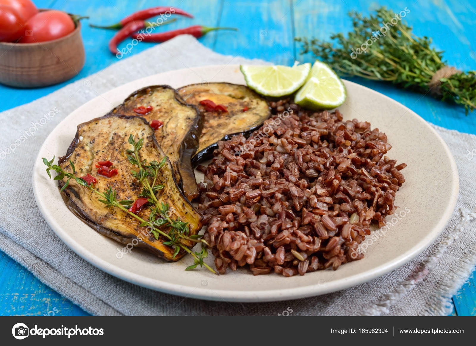 Baked slices of eggplant, butane red rice. Proper nutrition. Asian