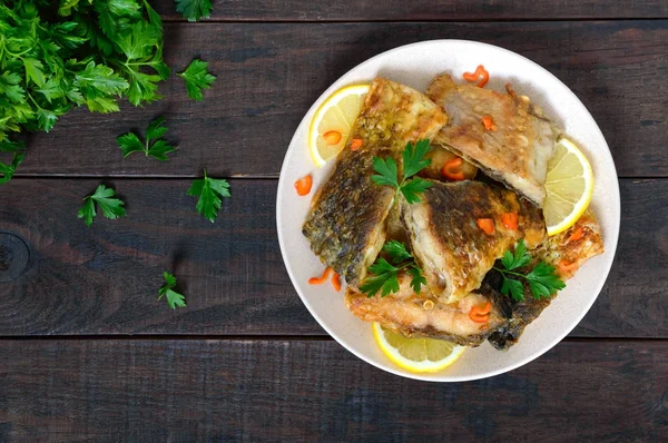 Pieces Roasted Carp Lemon Greens Plate Dark Wooden Background Top — Stock Photo, Image