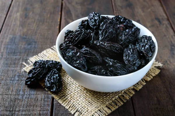 Prunes Ceramic Bowl Dark Wooden Background Dried Fruits — Stock Photo, Image