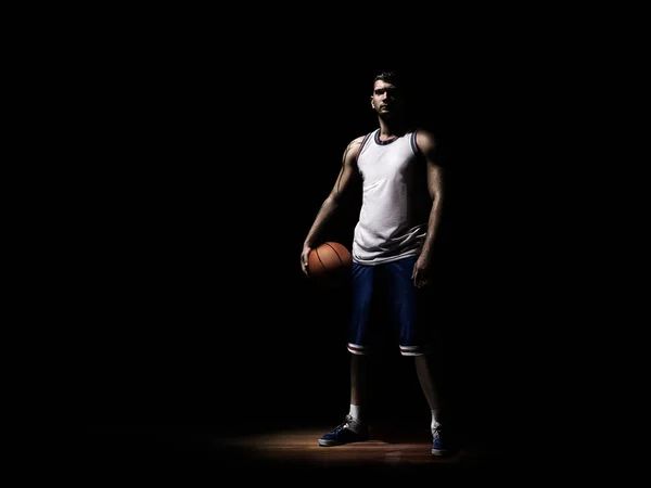 Basketball player standing in durkness on parquet with ball — Stock Photo, Image