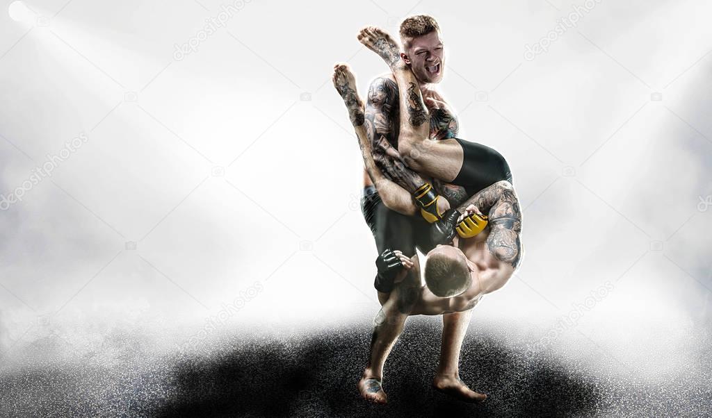 MMA fighters in lights background