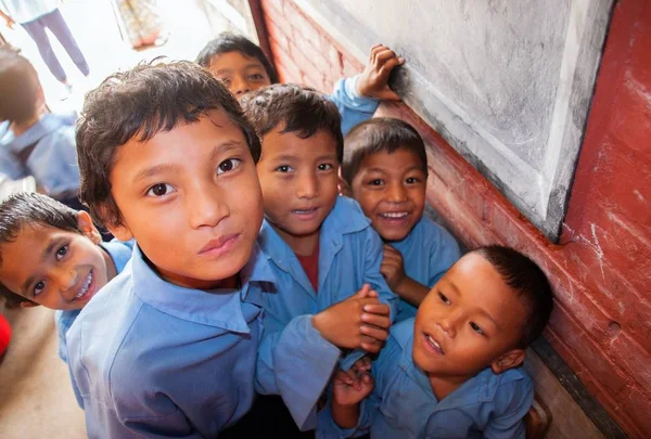 Children in school uniform smiling at camera — Stock Photo, Image