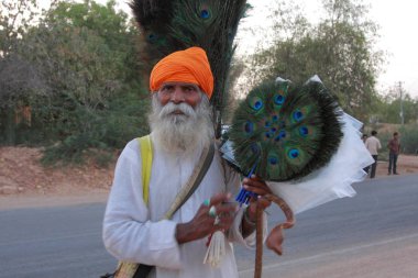 Indian man with orange turban clipart
