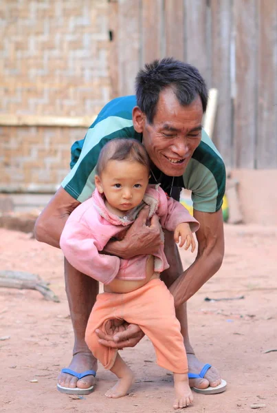 Unidentified Akha man with baby — Stock Photo, Image