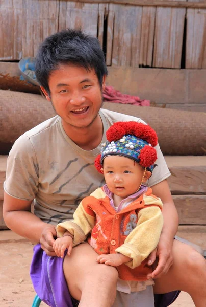 Unidentified Akha man with baby — Stock Photo, Image