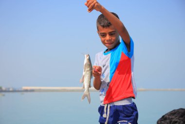 Balık, Hormoz Adası, Iran ile küçük çocuk