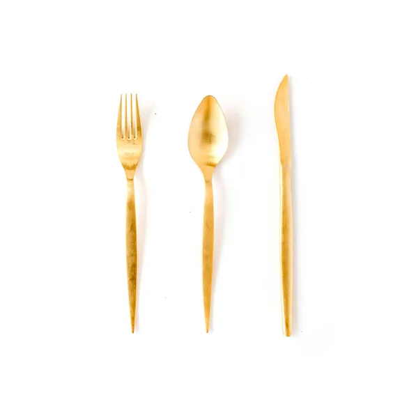 Tenedor dorado, cuchara, cuchillo — Foto de Stock