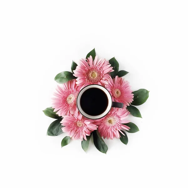 Black coffee mug and flowers