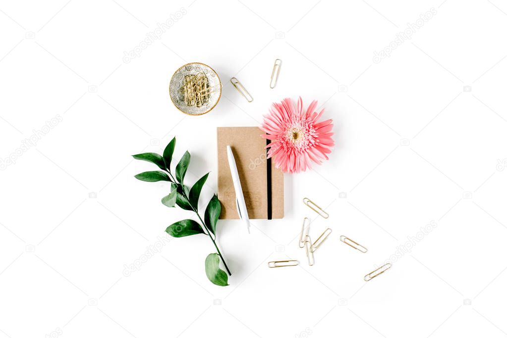 pink gerbera daisy, green branch, golden clips