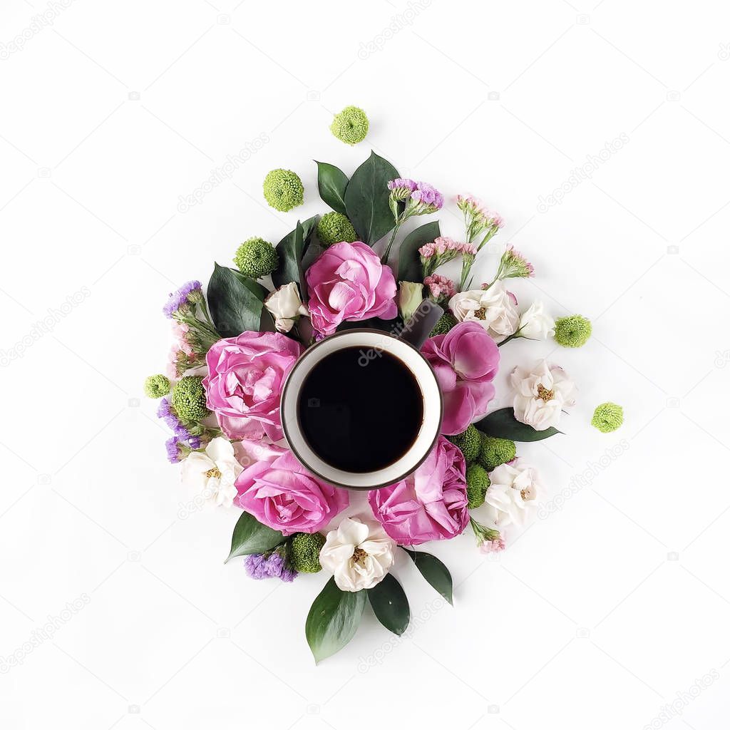 rses and petals with coffee cup on white