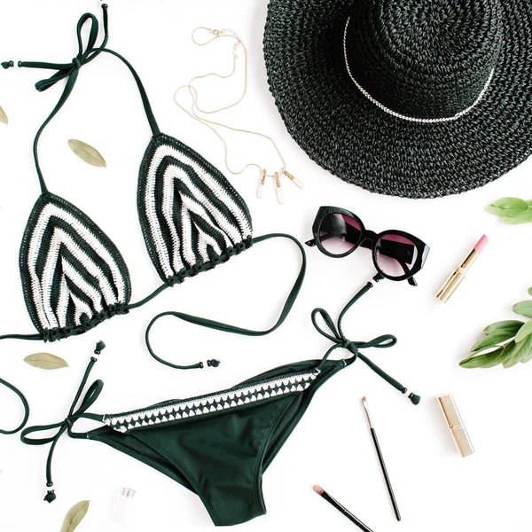 Female summer bikini swimsuit accessories collage on white with hat, green branches, necklace and sunglasses — Stock Photo, Image