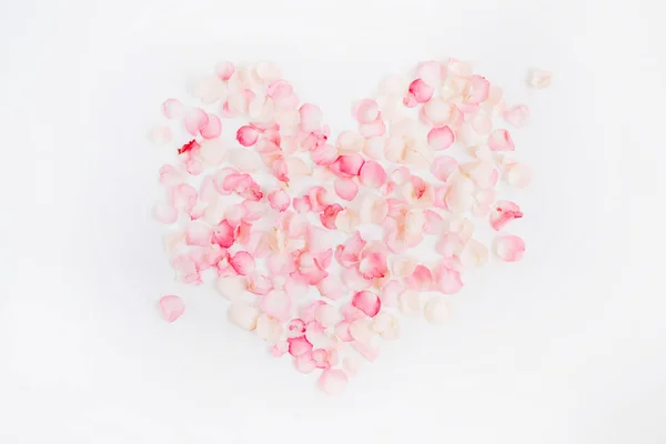 Heart symbol made of pink rose petals — Stock Photo, Image