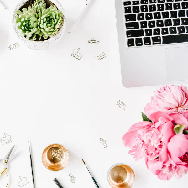Workplace with laptop, succulent, peonies, golden scissors — Stock Photo, Image