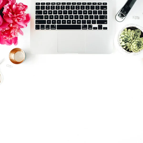 Workplace with laptop, succulent, peonies, golden scissors — Stock Photo, Image