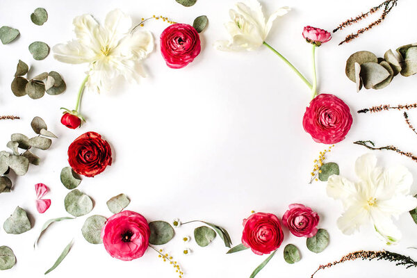 Floral frame of pink and red roses or ranunculus