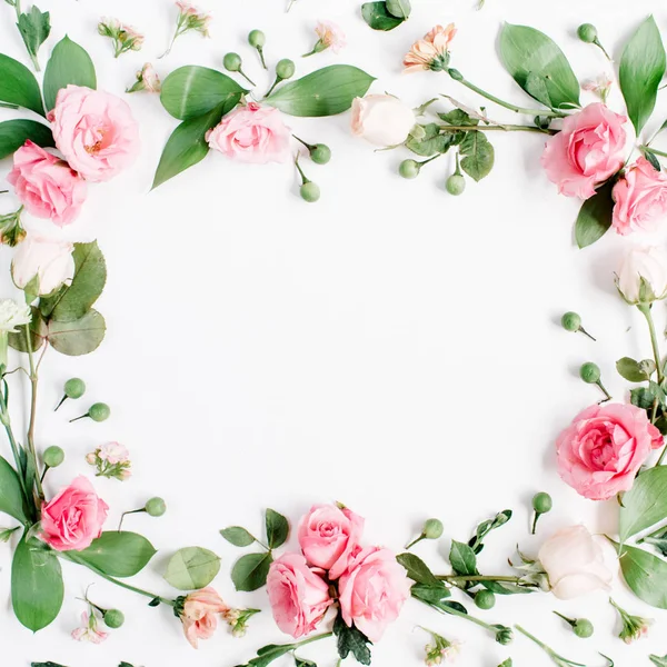 Round frame made of pink and beige roses