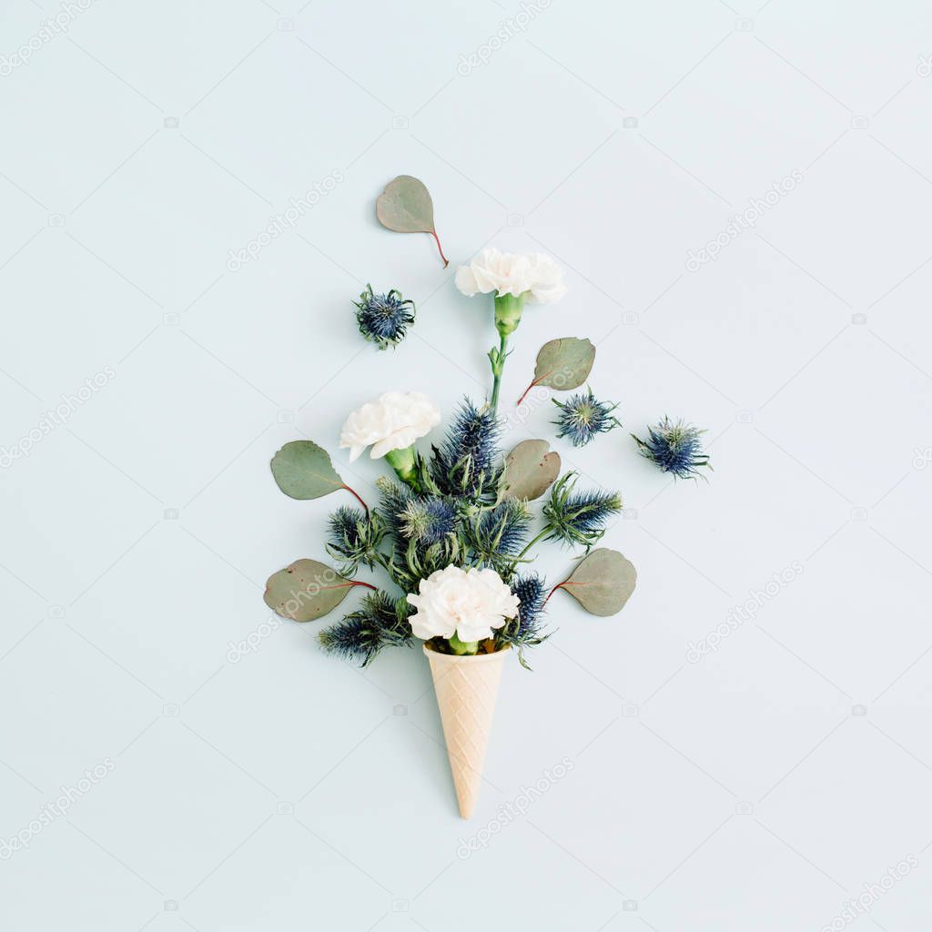 Waffle cone with white carnation and eucalyptus bouquet