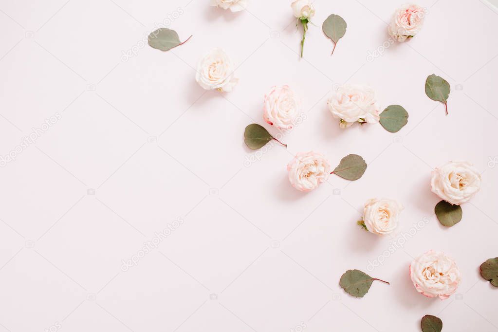 Flowers pattern texture made of beige roses, eucalyptus leaves