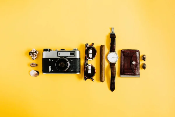 Traveler accessories on yellow background — Stock Photo, Image