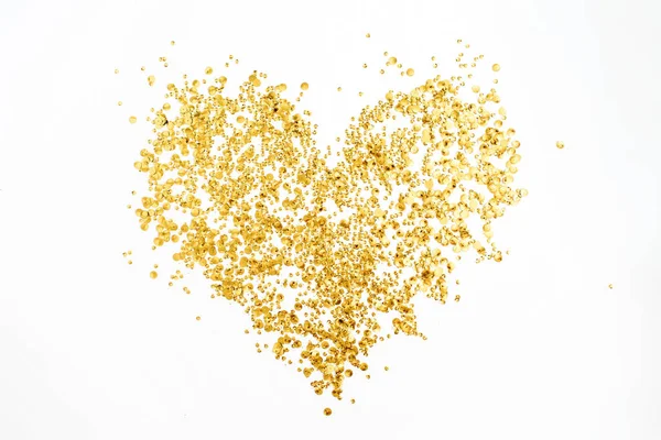 Corazón hecho de confeti dorado — Foto de Stock