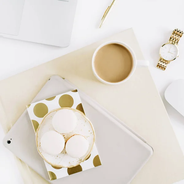 minimal desk workspace with macaroons