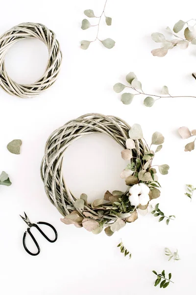 Wreath frame with cotton balls and eucalyptus branches