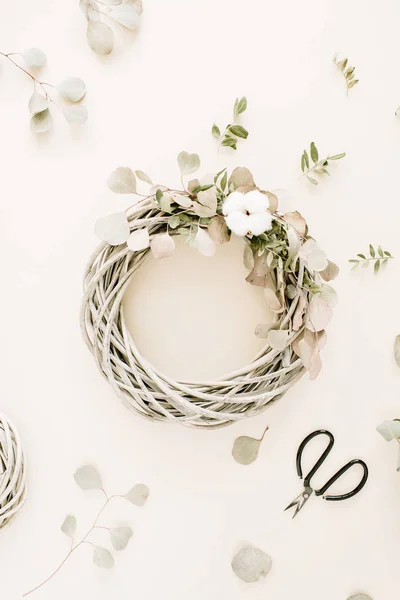 Wreath frame with cotton balls and eucalyptus branches