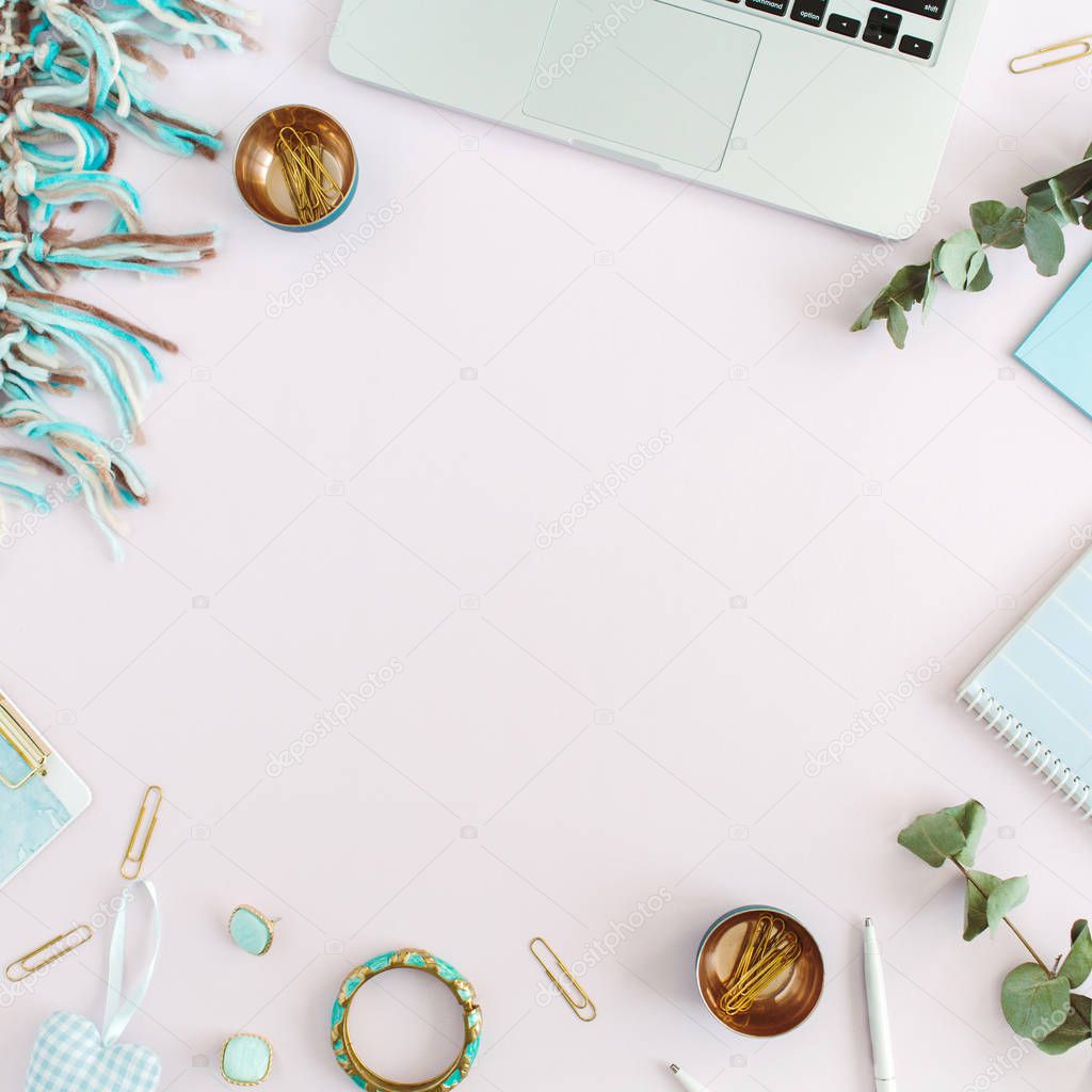 Workspace frame of laptop, plaid, clipboard, accessories on pink background. Flat lay, top view women business concept.