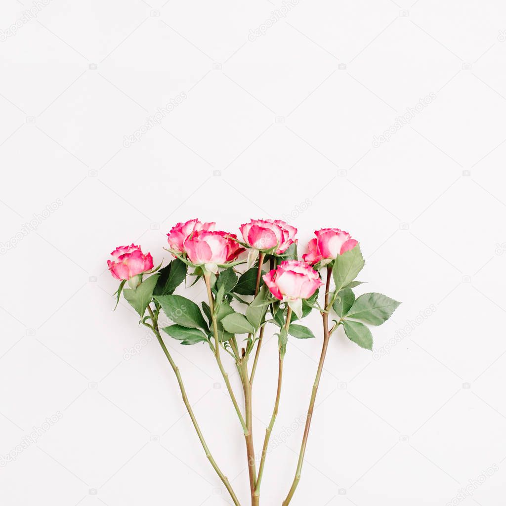 Red rose flowers bouquet. Flat lay, top view minimal spring floral header.