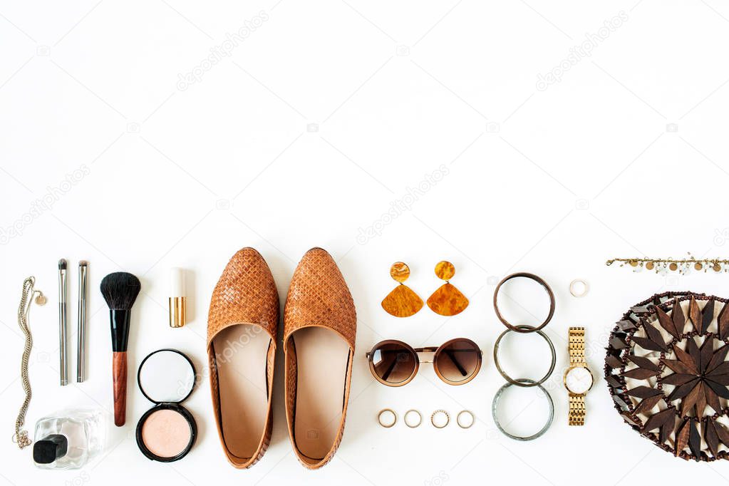 Women fashion cosmetics, accessories on white background. Flat lay, top view minimal trendy lifestyle collage. Shoes, sunglasses, purse bag, watch, powder, lipstick, brush, rings, bracelet, perfume.