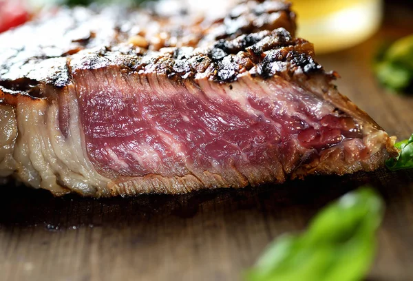 Steak on wooden board — Stock Image Steak on wooden board Royalty Free Stock Images