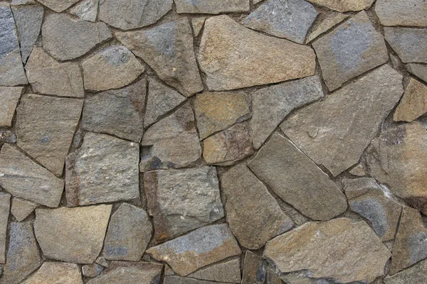 Old stone masonry wall texture background, natural stone backgro Stock Photo