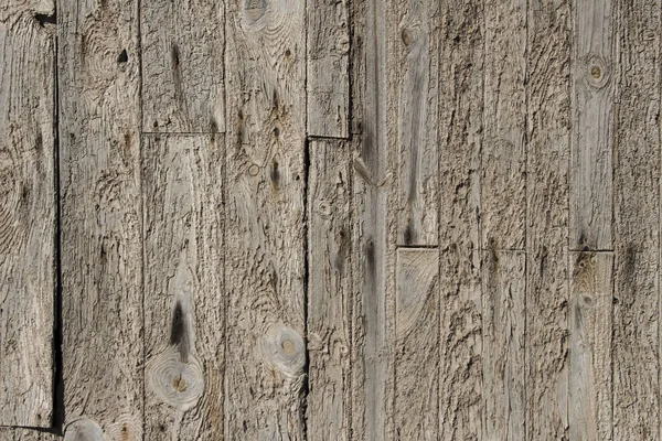 old and worn natural wood napkins, wall made of wooden planks