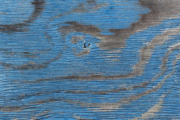 Old cracked and worn wooden board painted blue — Stockfoto