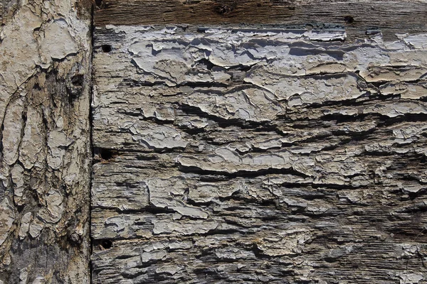 Gebarsten verf op oud hout, oud ruw houten patroon met sporen — Stockfoto