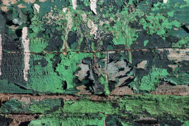 old green paint on wooden boards, traces of time, old wood textu