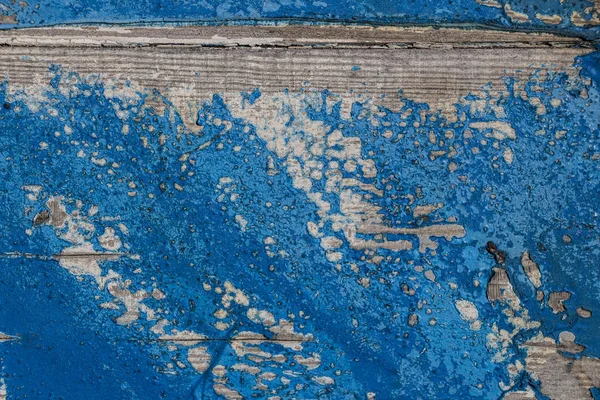 old board with blue paint traces, retro background aged wood sur