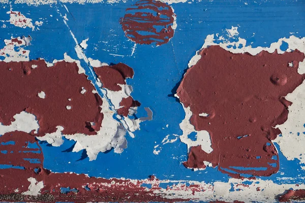 Soyut renk desenli grunge arkaplan, mavi ve kırmızı boya izli ahşap tahta, aşınmış ve çatlamış boya
