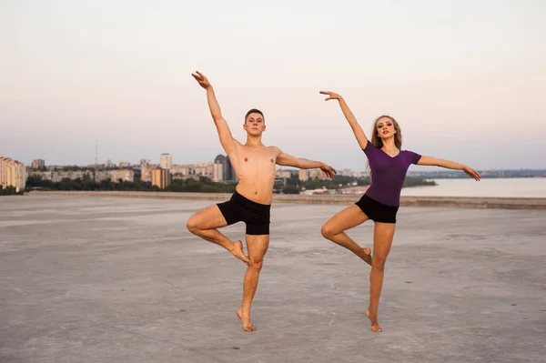 male and female dancer during a summer dance in the open air passionately and excitingly perform a dance