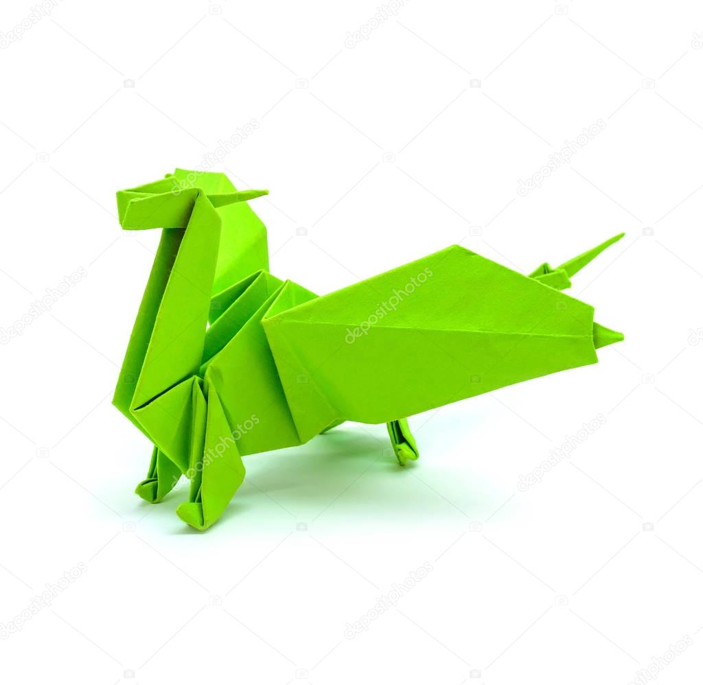 Photo of origami green dragon isolated on white background