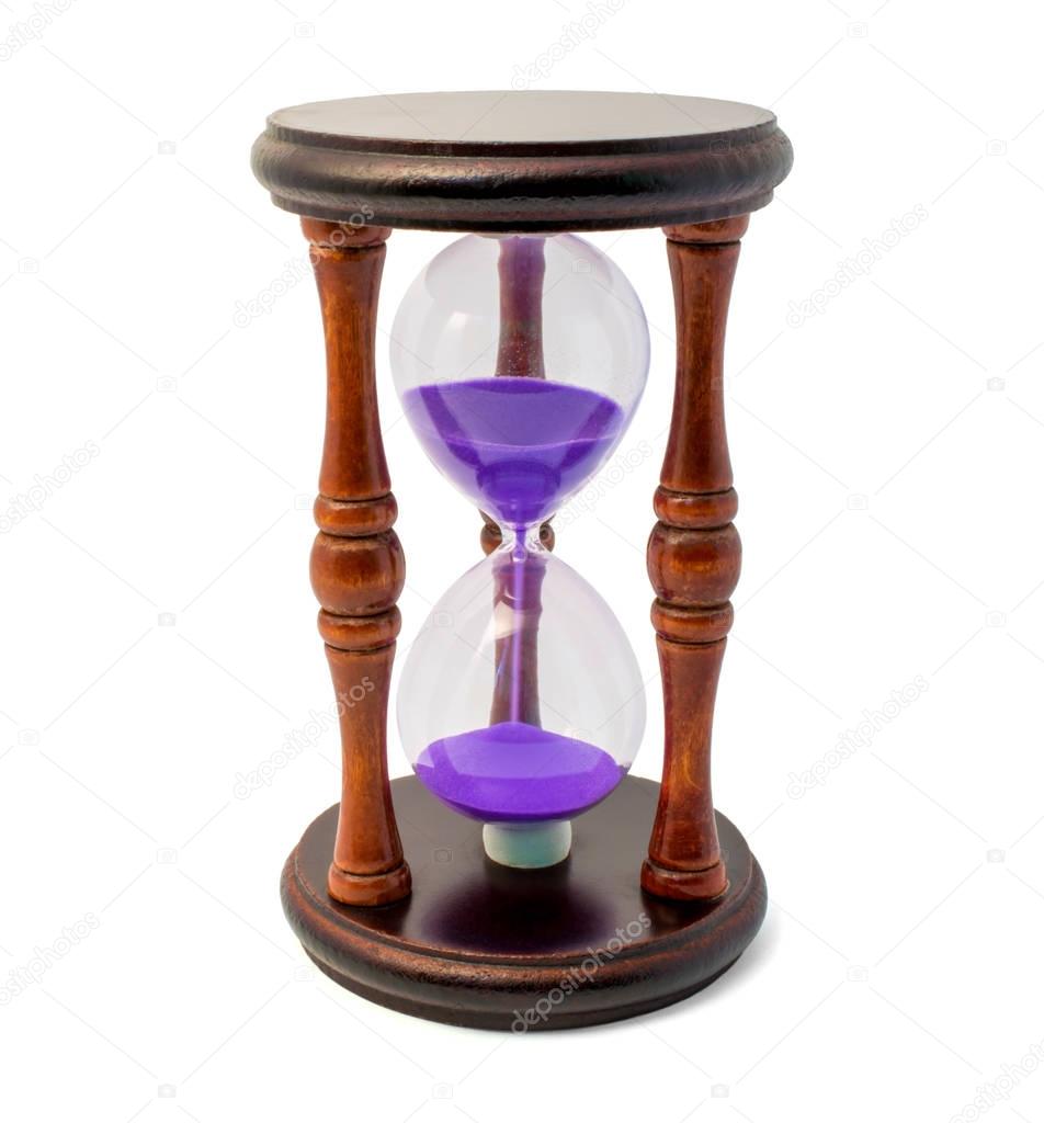 Brown hourglass with violet sand isolated on white backghound