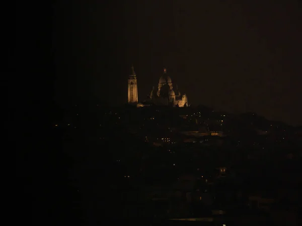 Vista nocturna de Le Sacre-Coeur desde el Arco del Triunfo —  Fotos de Stock