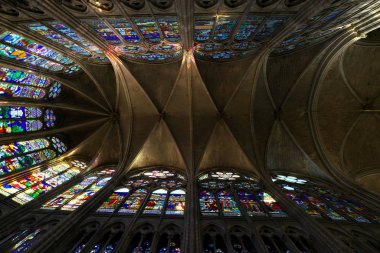 Paris, France-January 19,2018: Stained glass of Basilique Saint-Denis, a Gothic architecture and an architectural landmark in Paris. clipart