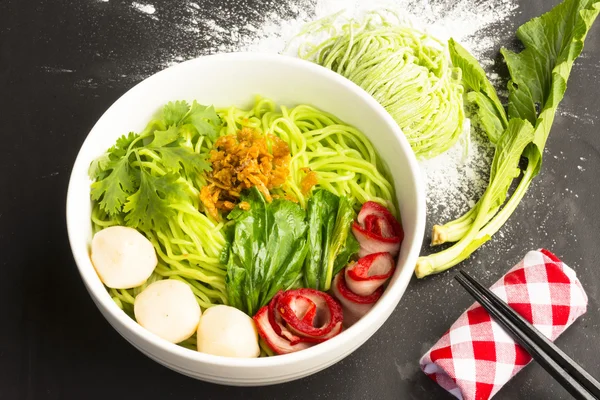 Noodles in Thailand Ba-Mee-Moo-Dang or pasta of Asia and dried noodles with ingredient on black table.Close up and top view — Stock Photo, Image