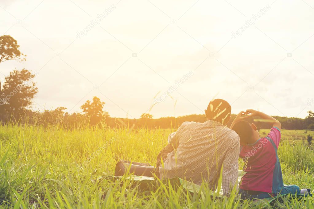Family with mountain view,Or Father and son are happy with travel and picnic with mountain and sunshine view
