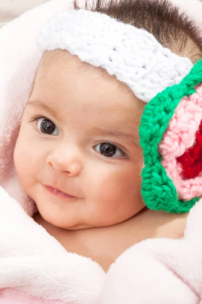 Baby girl wearing a crocheted headband — Stock Photo, Image