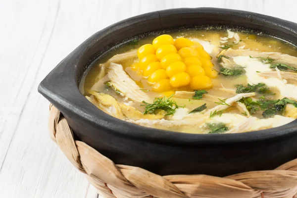 Traditional Colombian ajiaco served on black dish — Stock Image Traditional Colombian ajiaco served on black dish Stock Photo