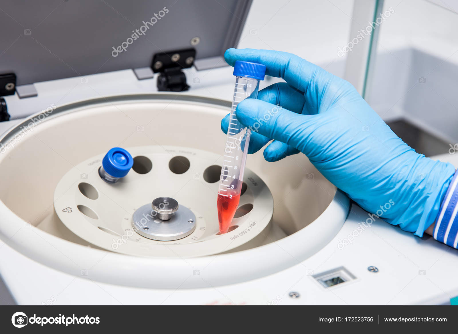 Inserting a tube in a laboratory centrifuge Stock Photo by ©anamejia18  172523756