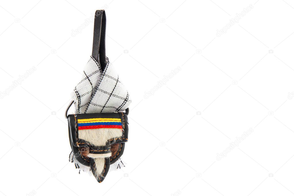 Colombian traditional leather satchel from the Antioquia Region called Carriel and poncho isolated on white background