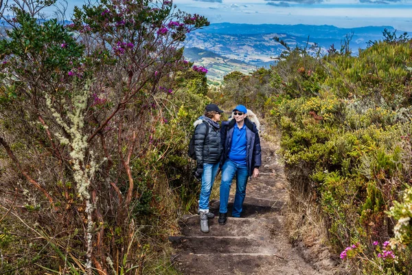 Young couple exploring nature at a beautiful paramo at the department of Cundinamarca in Colombia — Stock Photo, Image